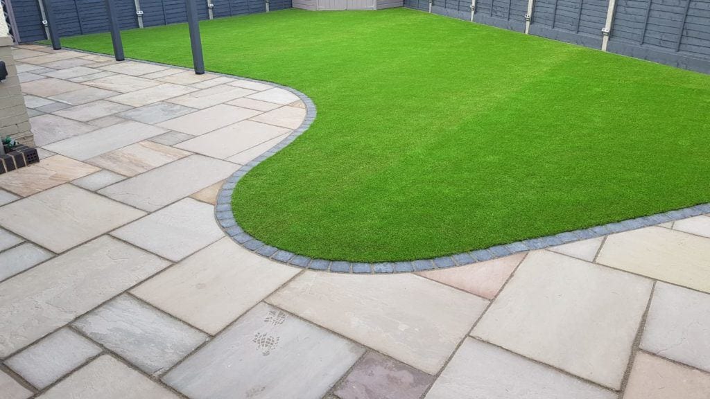 Photo of Raj Green patio slabs in use in a garden.