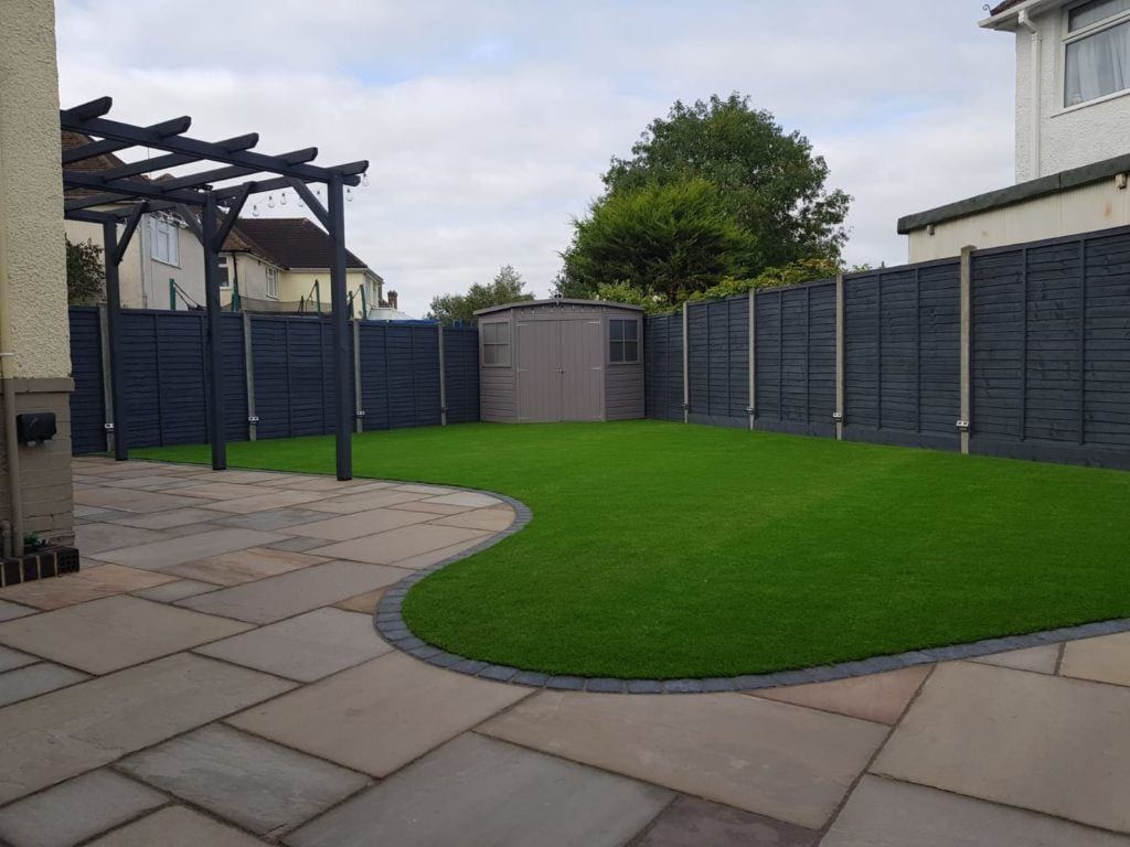 Photo of Raj Green patio slabs in use in a garden.
