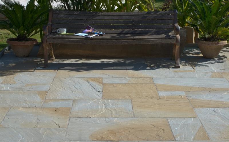 Photo of Yorkshire Swirl patio slabs in a garden.