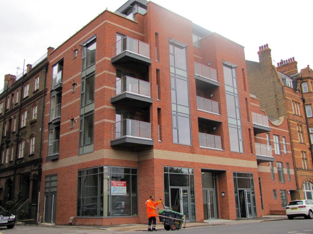 A photo of the Camtech Premier Orange Red Stock brick in use.