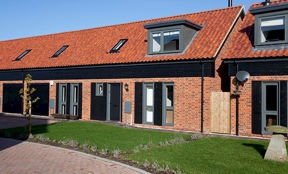 A photo of the Camtech Premier Manor Red Multi Stock brick in use.