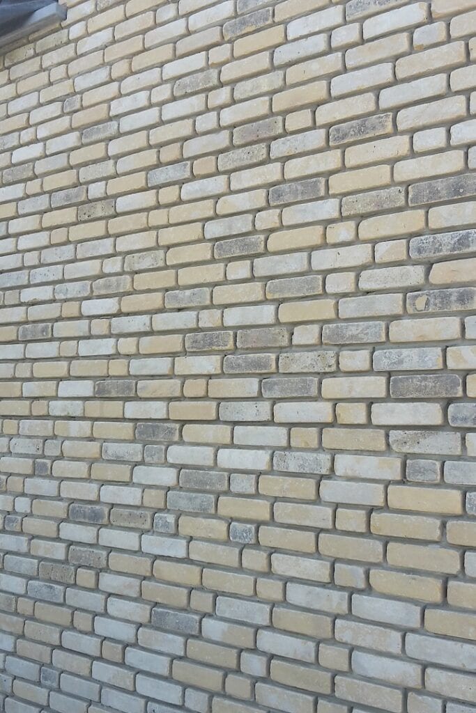 A photo of the Camtech Yellow Grey Multi Rustica brick in use.