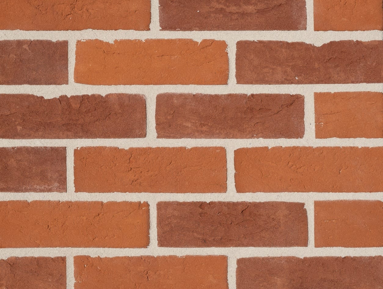 A photo of the Camtech Premier Orange Red Handmade brick in use.