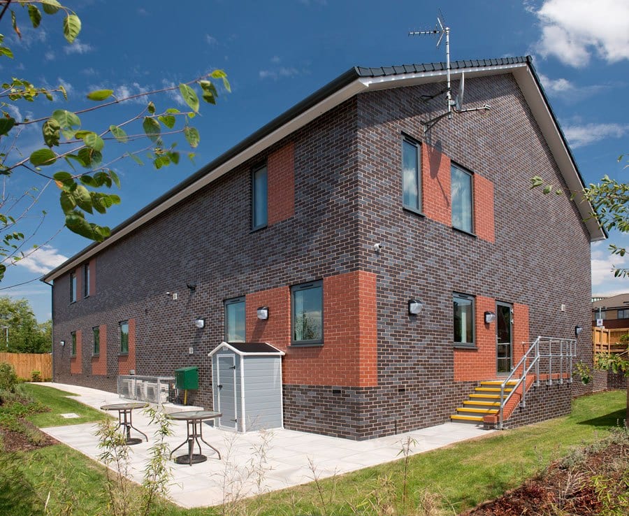 A photo of the MBH Blockley Hadley Red Smooth brick in use.