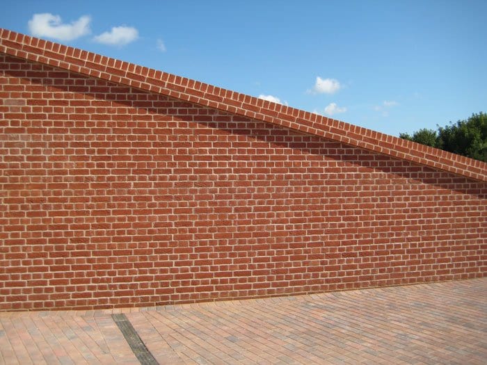 A photo of the MBH Charnwood Farnham Red Handmade brick in use.