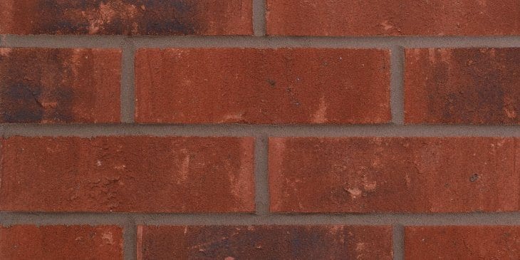 A photo of the Forterra Butterley Lindum Cottage Red Multi brick in use.